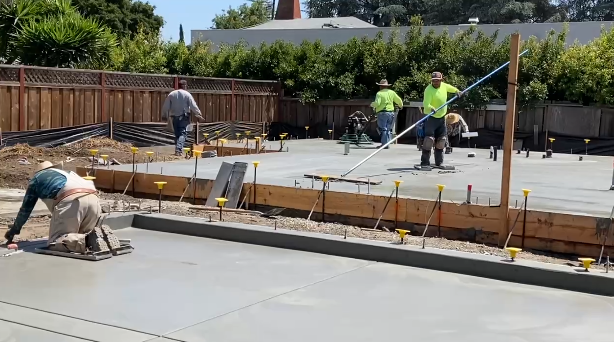 Foundation being poured on building site.